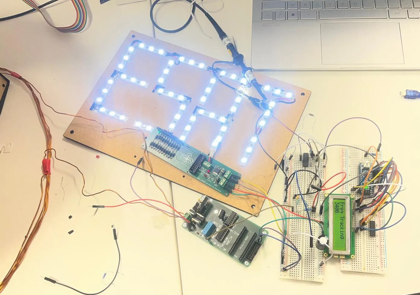 The drone resting on the landing platform with the LED strip lit.